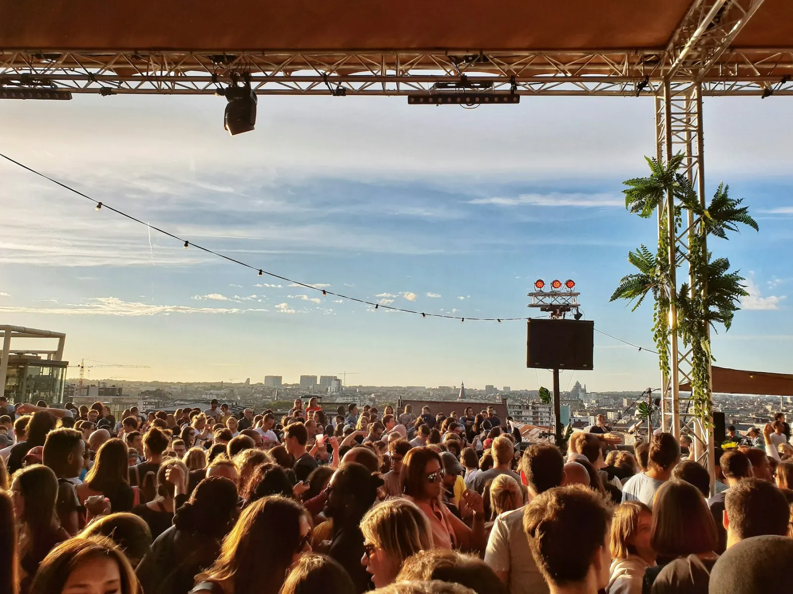 A rooftop crowd gathered for a live event